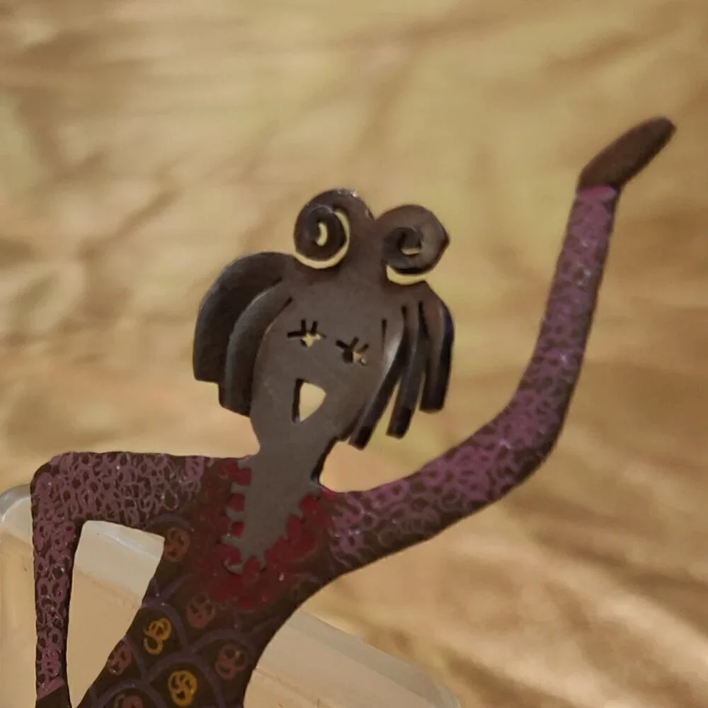 Brooch of a whimsical girl Figure Skater. Signed GB.